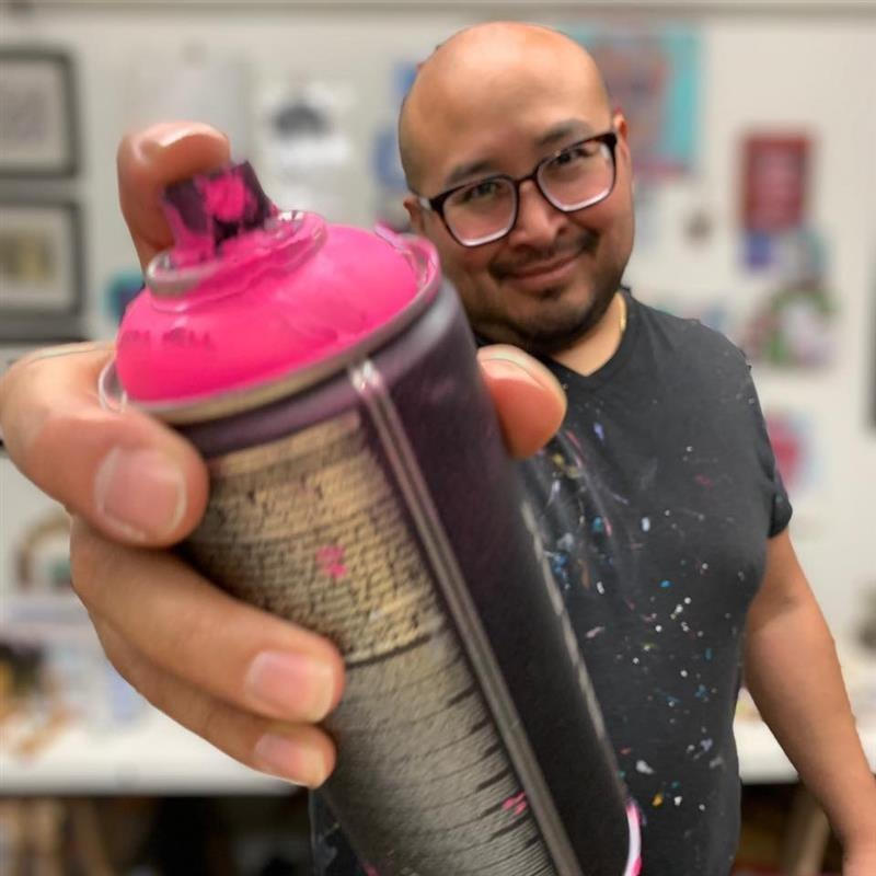 Steve Javiel holding can of spray paint